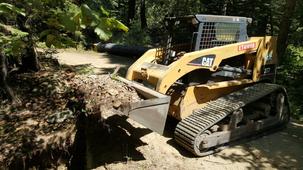 Bobcat services in Chico digging a trench